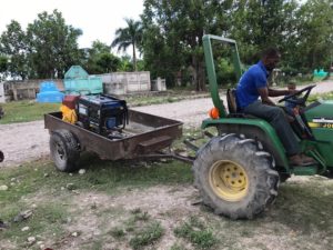 tractor moves generator from post to post